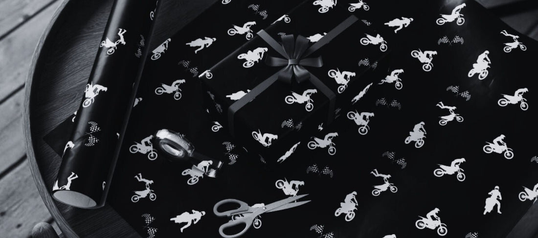 image of white on black motocross themed gift wrap
