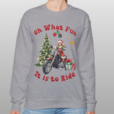 Person wearing a gray sweatshirt with Christmas-themed design and text.