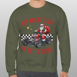 Person wearing a green sweatshirt with a festive design featuring Santa Claus on a motorcycle.