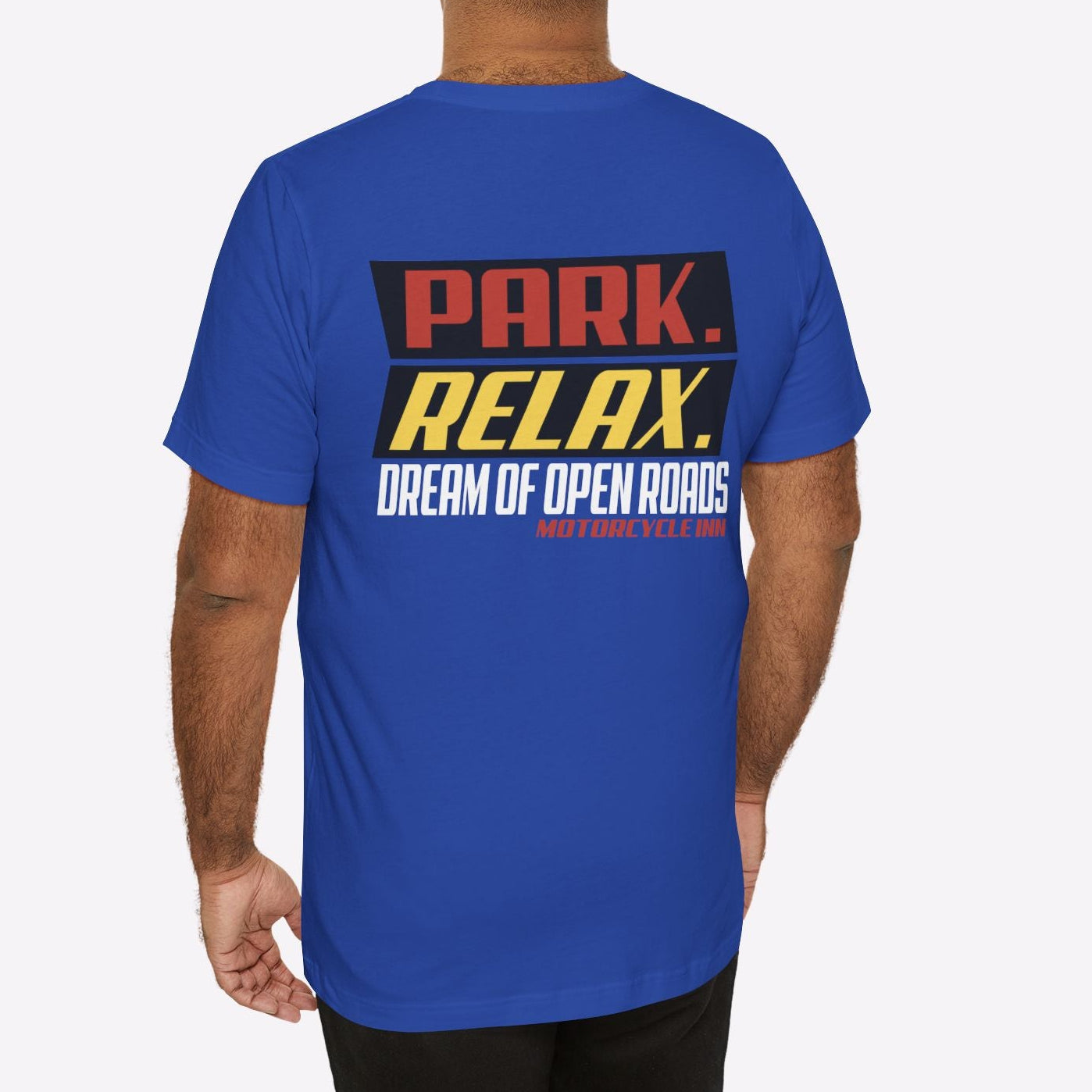 Man wearing a blue t-shirt with text on the back against a white background