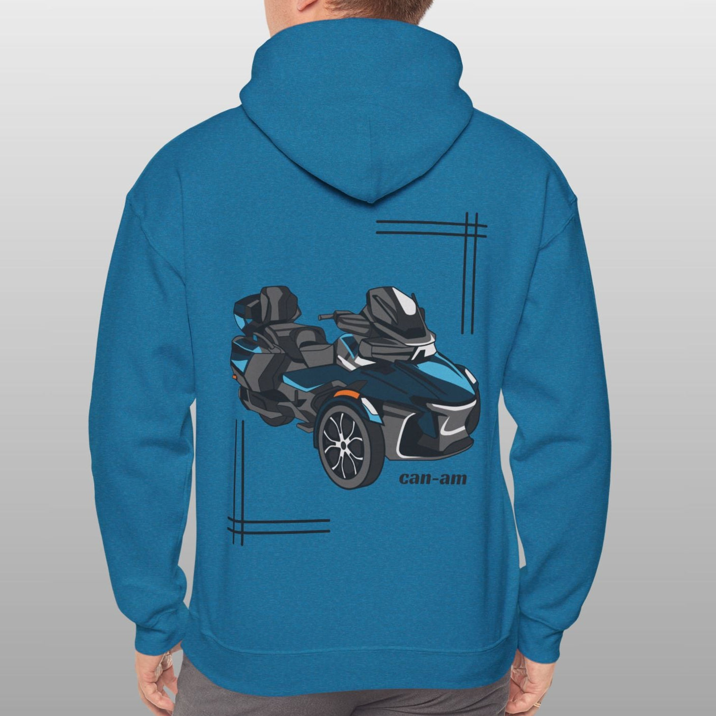 Person wearing a blue hoodie with a car graphic on the back against a gray background