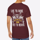 Man wearing a maroon t-shirt with motorcycle-themed text on the back