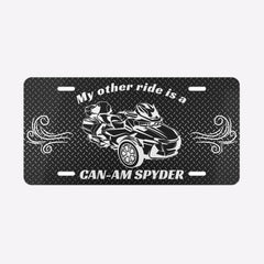 License plate with a graphic of a Can-Am Spyder and text on a black background