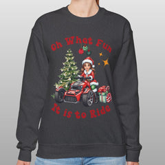 Person wearing a dark gray sweatshirt with Christmas-themed design on a plain background