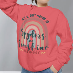 Person wearing a red sweatshirt with a rainbow design and text on a gray background