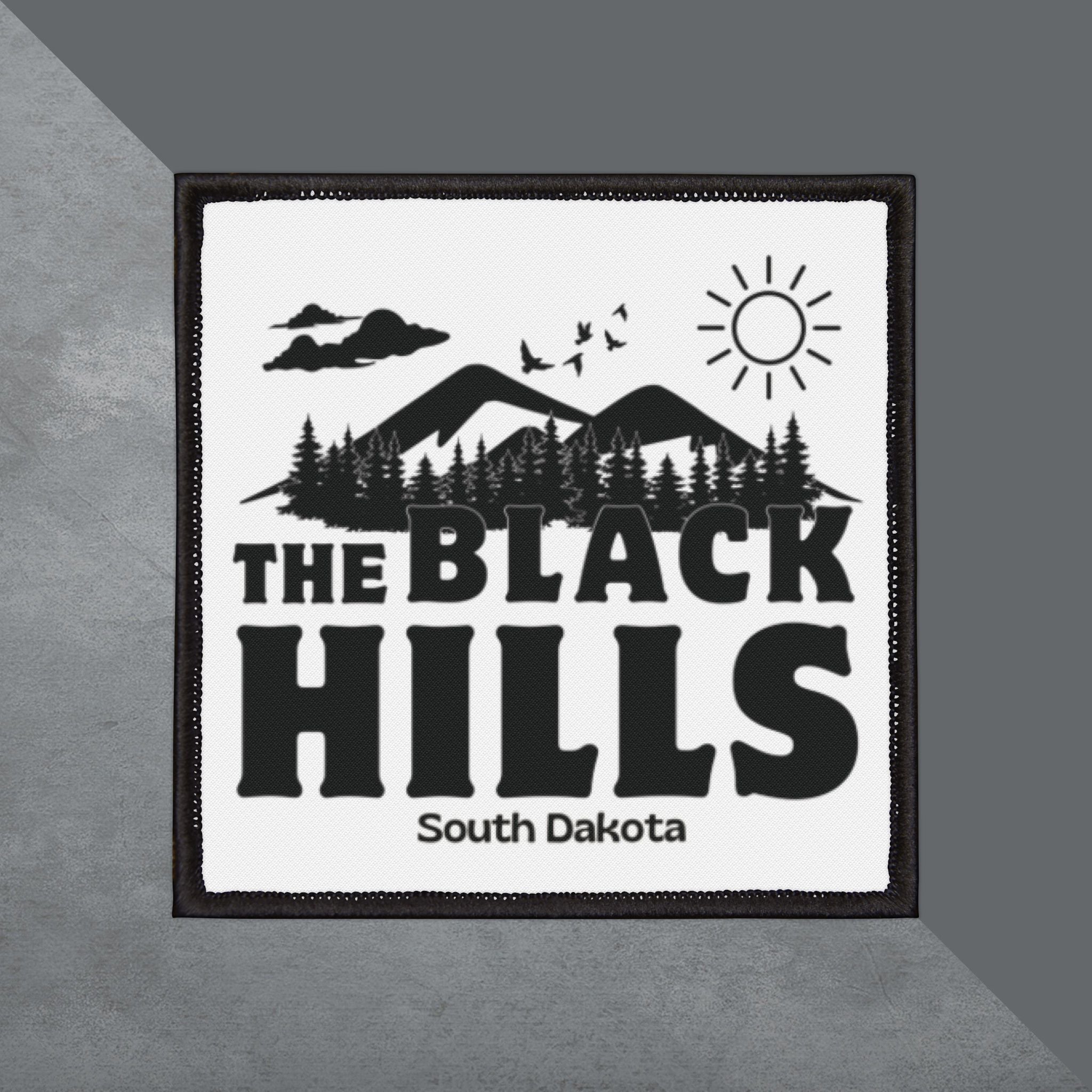 Patch with 'The Black Hills, South Dakota' text and mountain design on a gray background