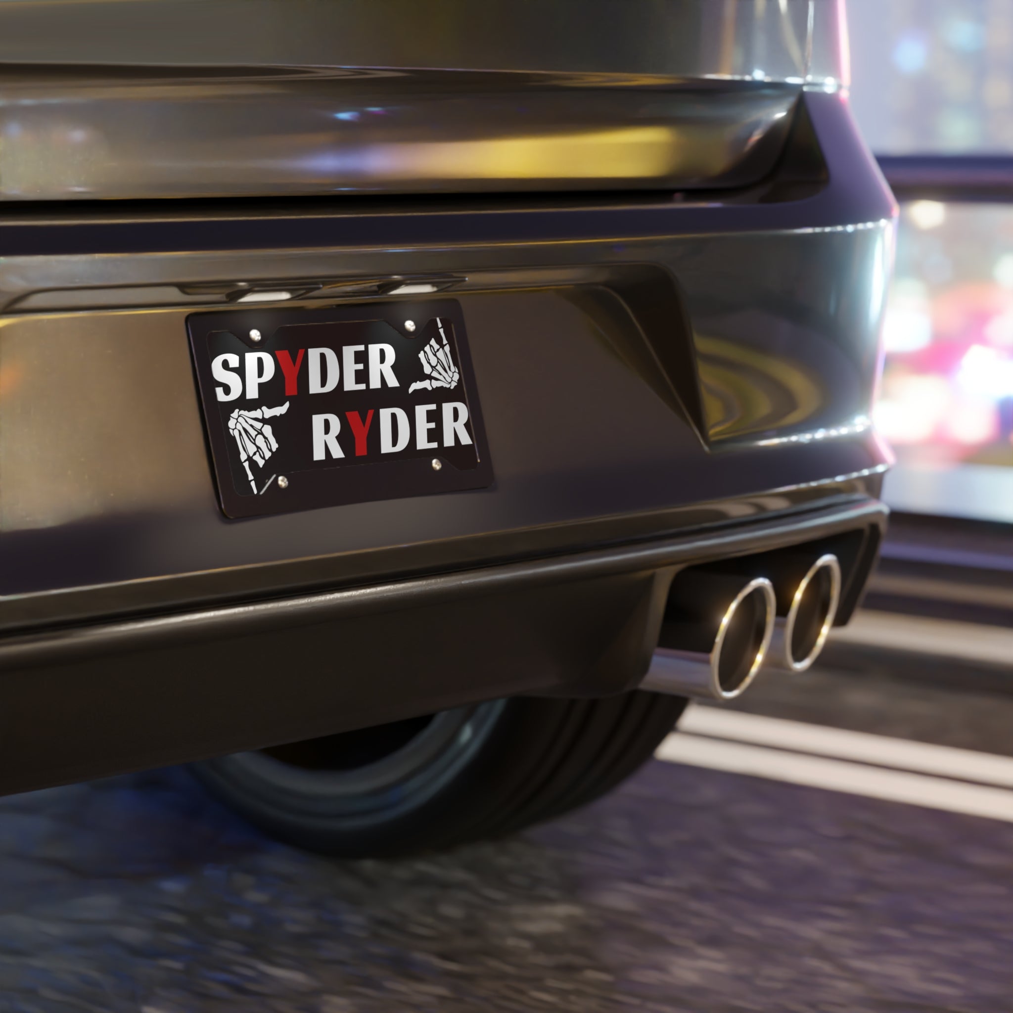 Car exhaust system with a 'Spyder Ryder' sticker on a blurred background
