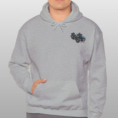 Man wearing a gray hoodie with a small logo on a plain background