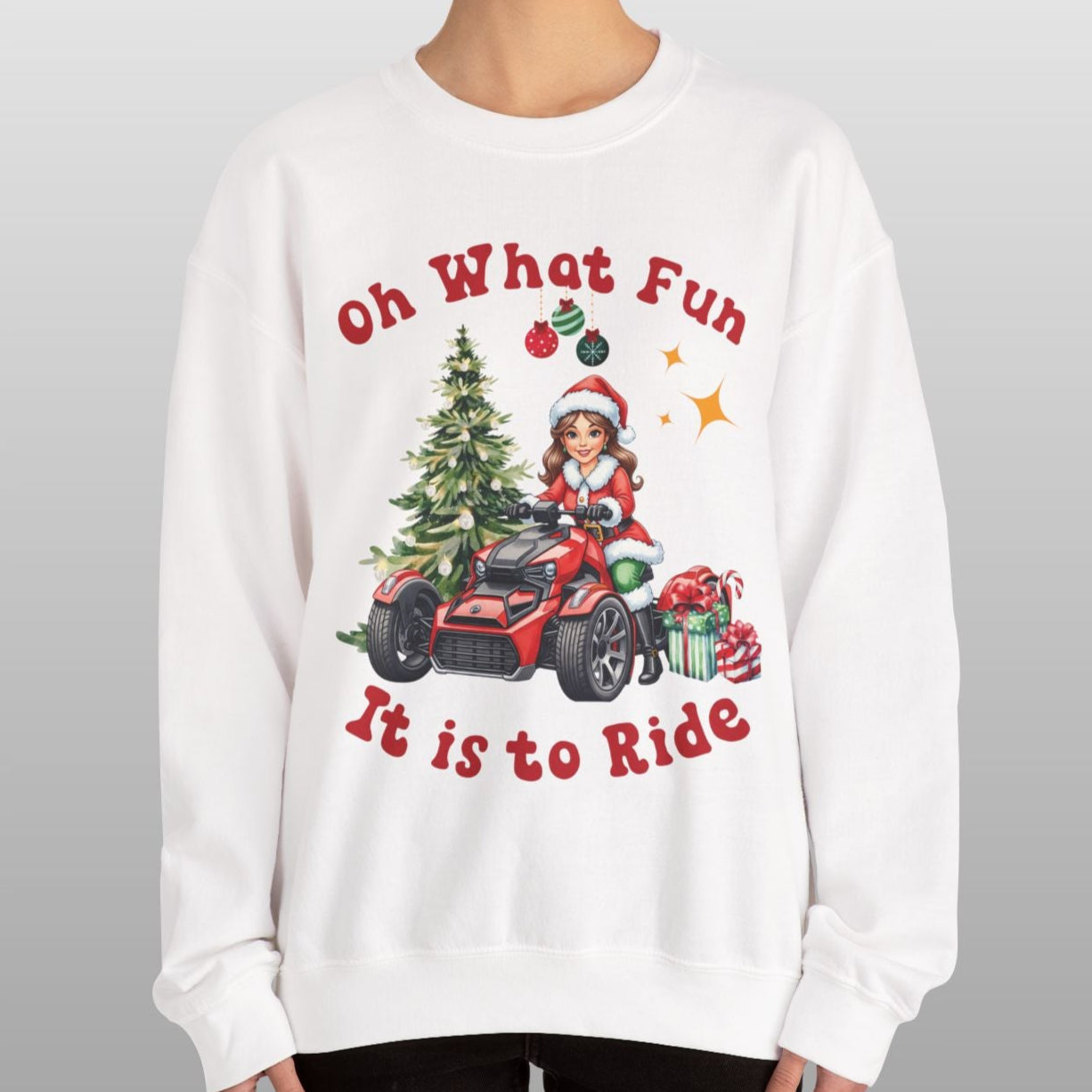 Person wearing a white sweatshirt with Christmas-themed design and text.