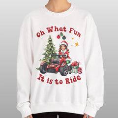 Person wearing a white sweatshirt with Christmas-themed design and text.
