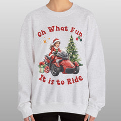 Person wearing a Christmas-themed sweatshirt with graphics and text on a plain background