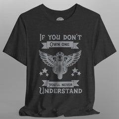 Black t-shirt with graphic design and text on a gray background