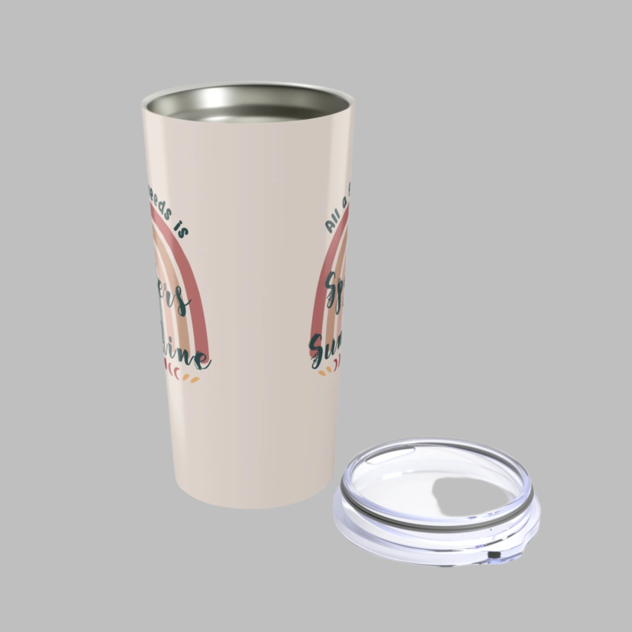 Tumbler with rainbow design and text on a white background