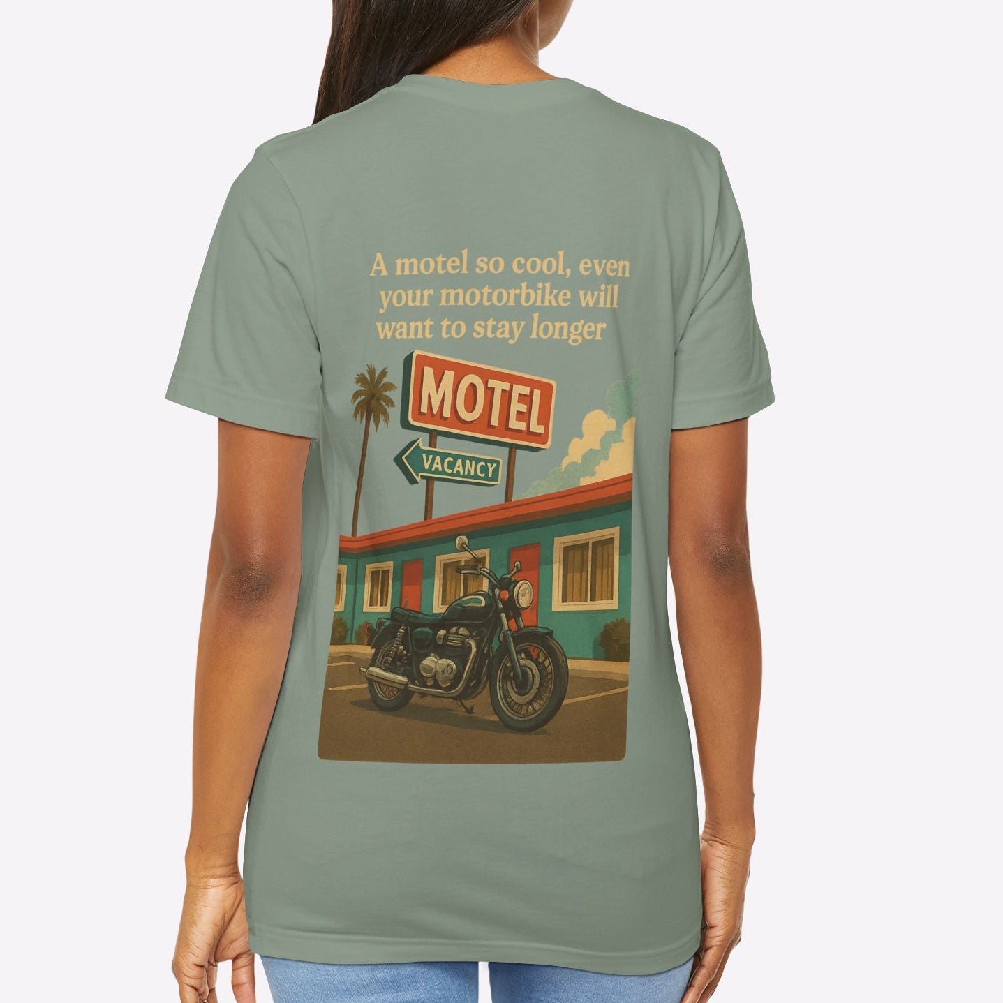 Person wearing a t-shirt with a graphic of a motel and motorcycle on the back.