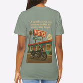 Person wearing a t-shirt with a graphic of a motel and motorcycle on the back.