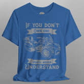 Blue t-shirt with graphic of a three-wheeled vehicle and text on a gray background