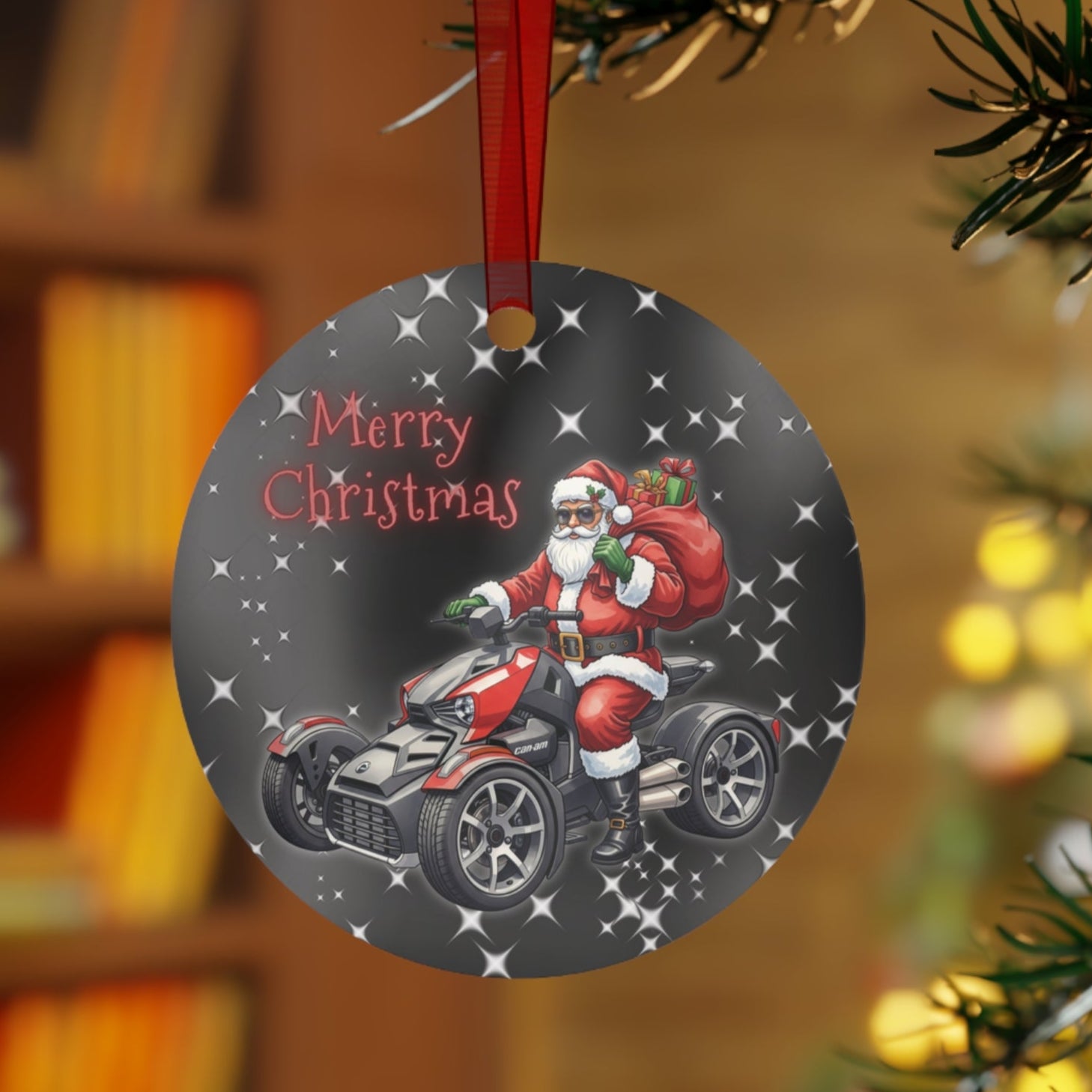 Christmas ornament with Santa Claus on a ATV hanging on a tree