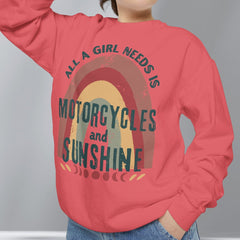 Person wearing a red sweatshirt with a graphic and text, standing against a plain background