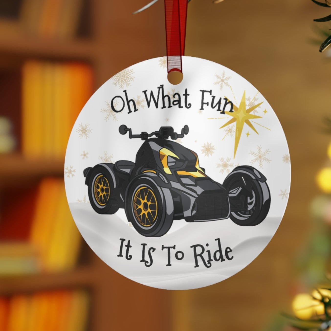 Round Christmas ornament with ATV graphic and text 'Oh What Fun It Is To Ride' on a blurred background.