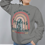 Person wearing a gray sweatshirt with a rainbow design and text on a plain background