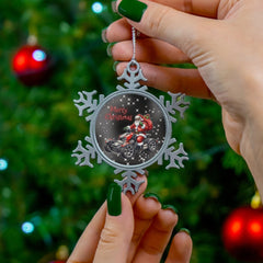 Person holding a snowflake-shaped Christmas ornament with a tree in the background