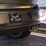 Car rear with 'Spyder Ryder' decal on a blurred background