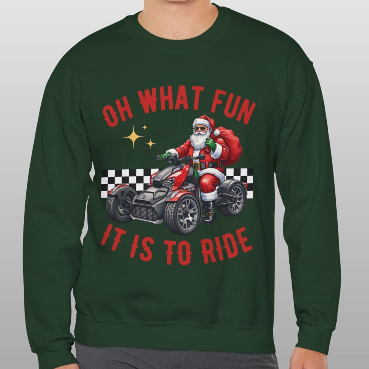 Man wearing a green sweatshirt with Santa Claus riding a motorcycle graphic and text.