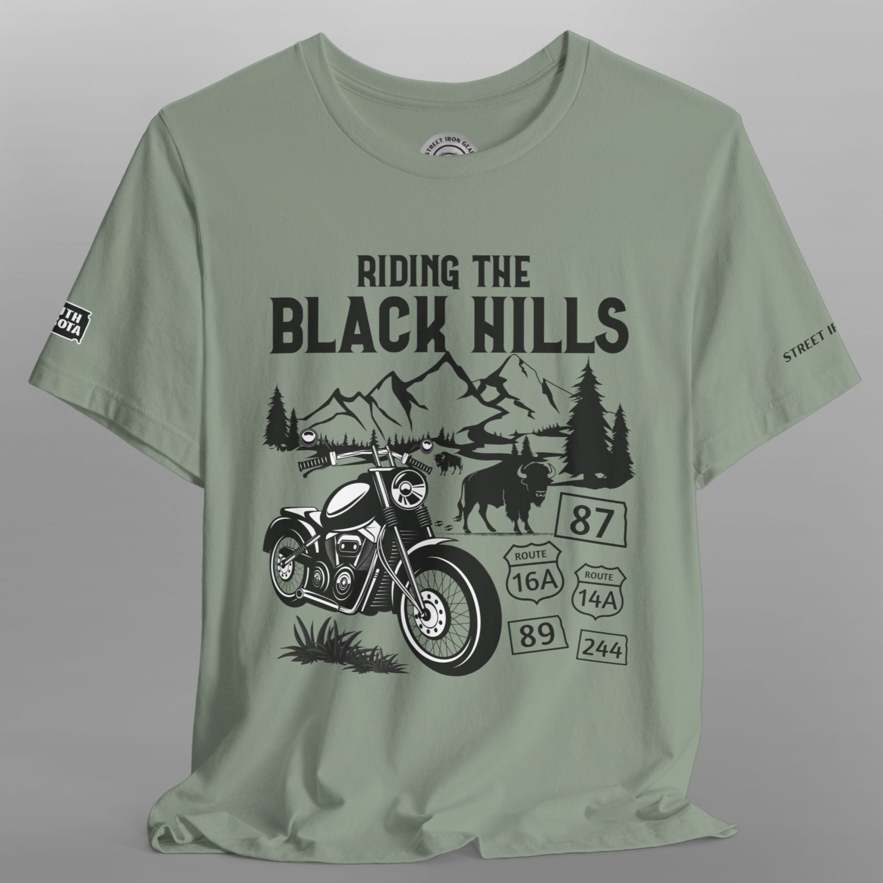 Green t-shirt with black graphic design on a gray background