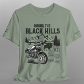 Green t-shirt with black graphic design on a gray background
