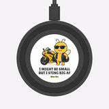 Round black device with a bee character and text on a white background