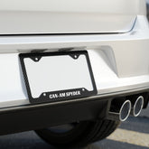 Car license plate frame with 'CAN-AM SPYDER' branding on a vehicle's rear bumper.