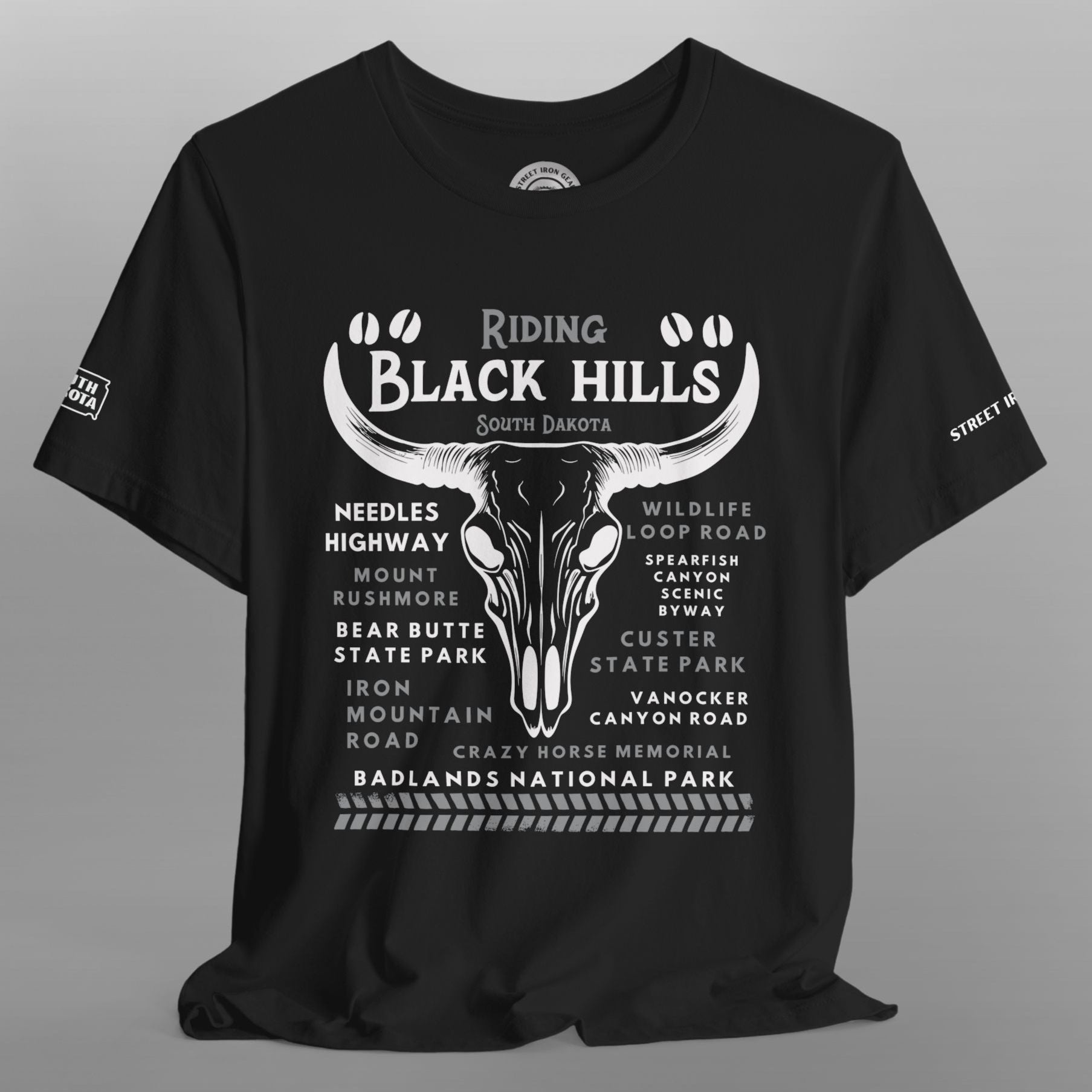 Black t-shirt with white graphic design on a gray background