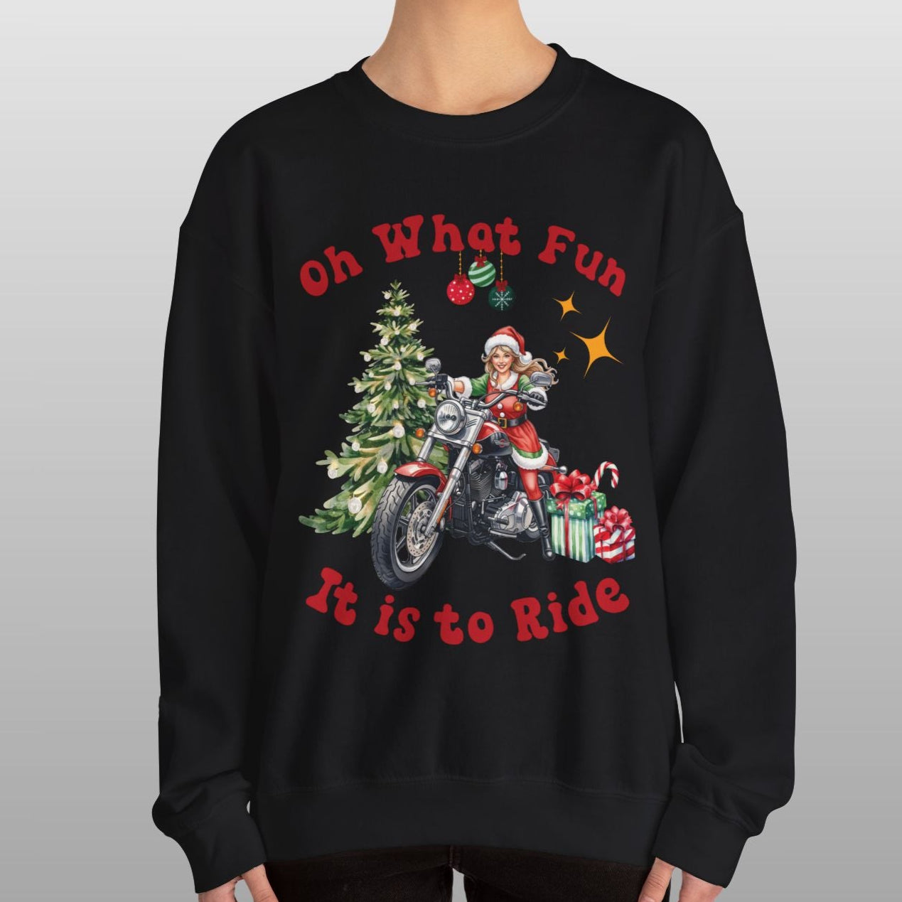Person wearing a black sweatshirt with a Christmas-themed design and text.