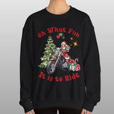Person wearing a black sweatshirt with a Christmas-themed design and text.