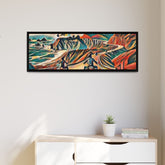 A framed canvas art print featuring an abstract motorcycle design with vibrant colors displayed on a wall above a wooden cabinet.