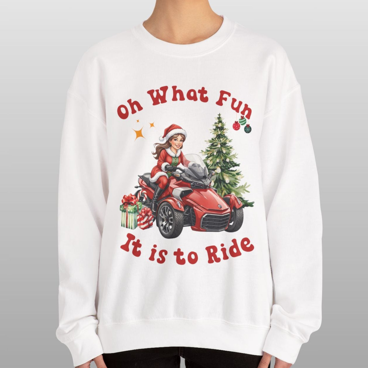 Person wearing a white sweatshirt with Christmas-themed design and text.