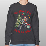 Person wearing a black sweatshirt with Christmas-themed design on a plain background