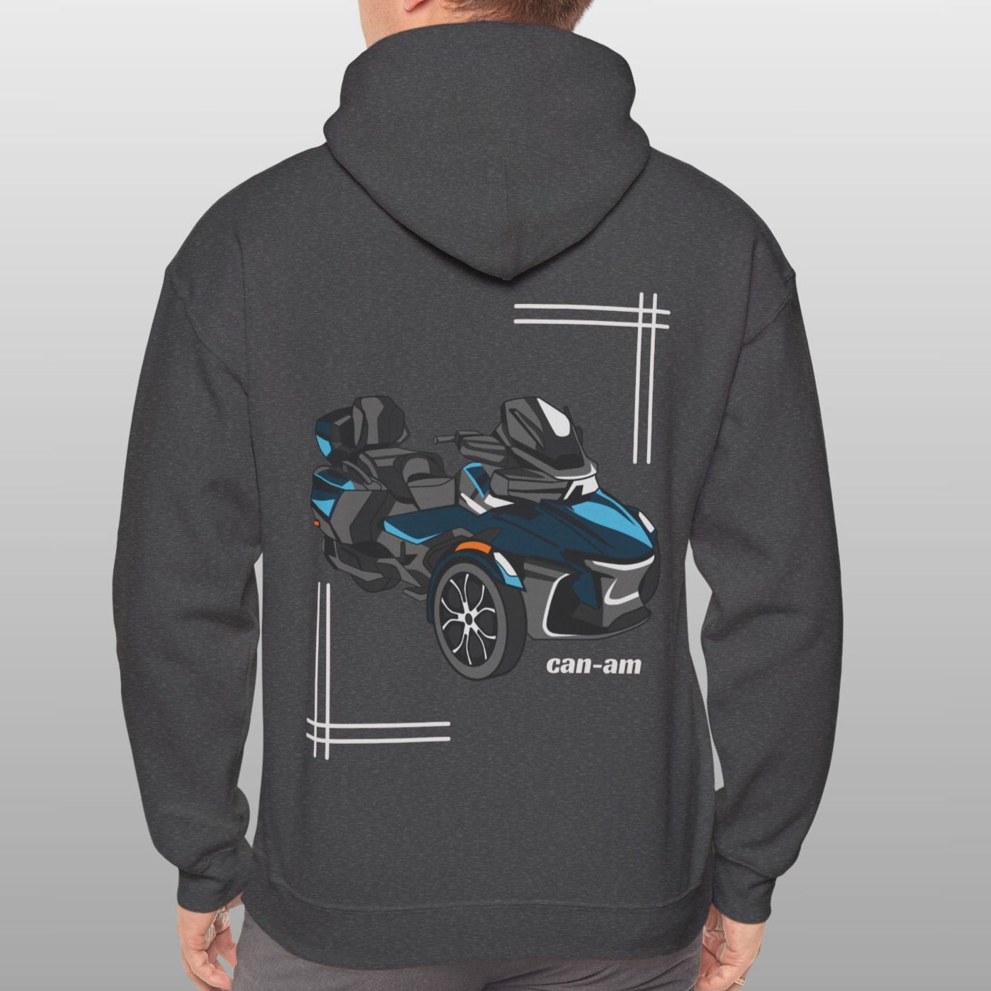 Person wearing a dark gray hoodie with a graphic of a vehicle on the back against a light gray background