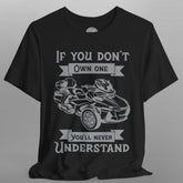 Black t-shirt with graphic of a go-kart and text on a gray background