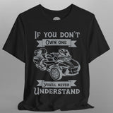 Black t-shirt with graphic of a go-kart and text on a gray background