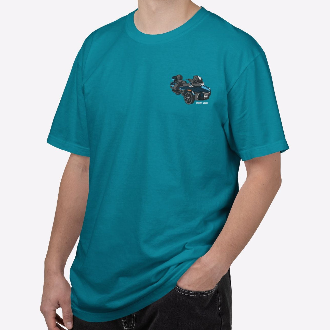 Man wearing a teal t-shirt with a logo on a white background