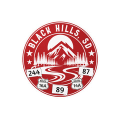 Logo of Black Hills, SD with mountain and road design on a red circle.