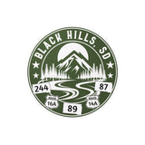Logo of Black Hills, SD with mountain and road design on a Green background