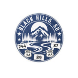 Logo of Black Hills, SD with mountain and road design on a Blue background
