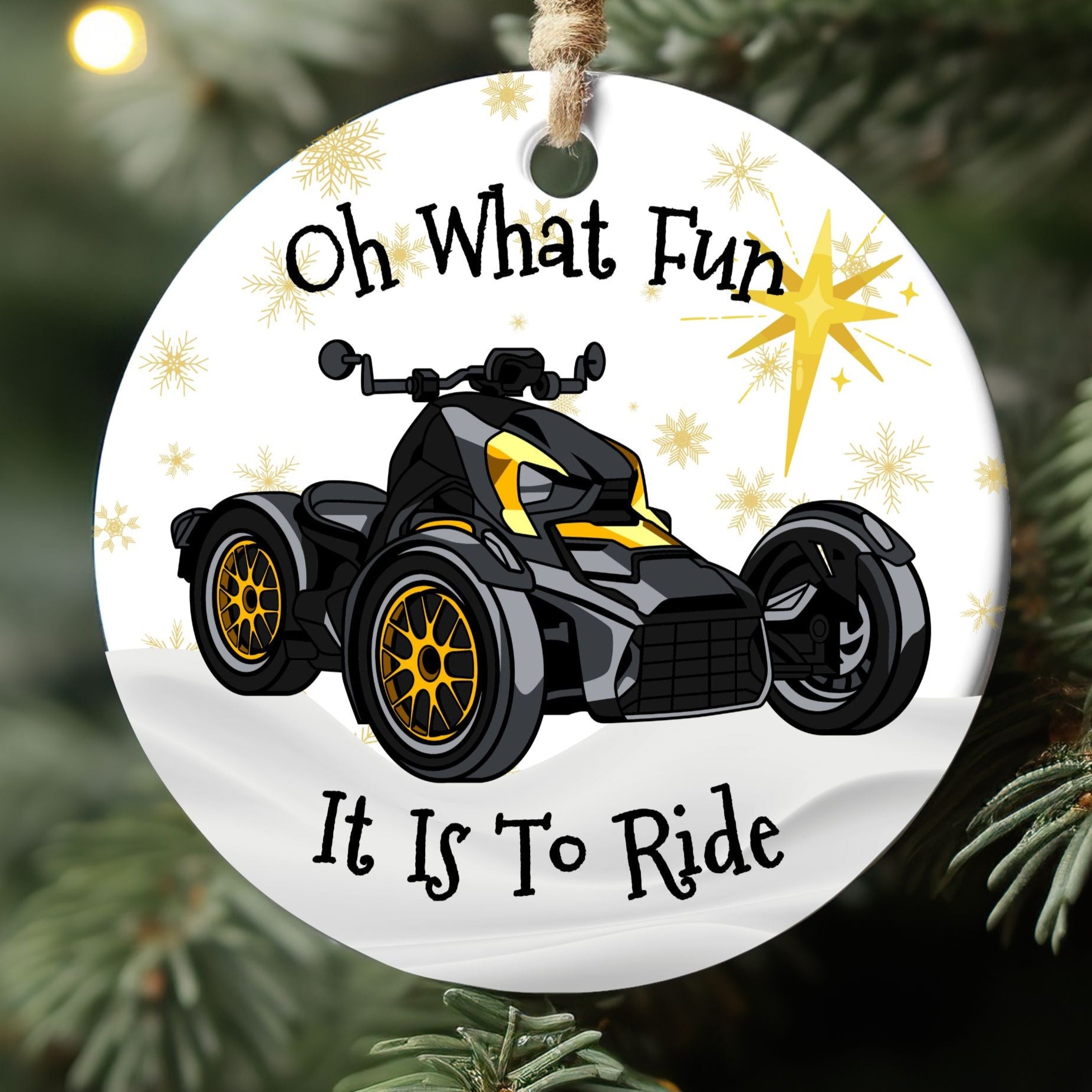 Round Christmas ornament with ATV graphic and text 'Oh What Fun It Is To Ride' on a tree.