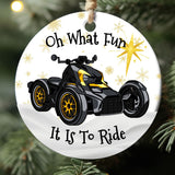 Round Christmas ornament with ATV graphic and text 'Oh What Fun It Is To Ride' on a tree.