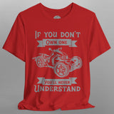 Red t-shirt with graphic design and text on a gray background