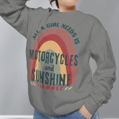 Person wearing a gray sweatshirt with a colorful graphic and text on a plain background