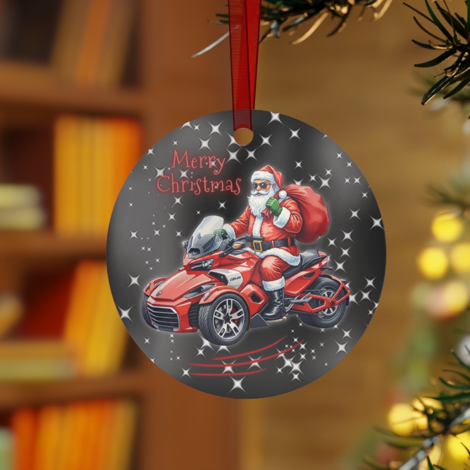 Christmas ornament with Santa Claus riding a red ATV on a tree branch.