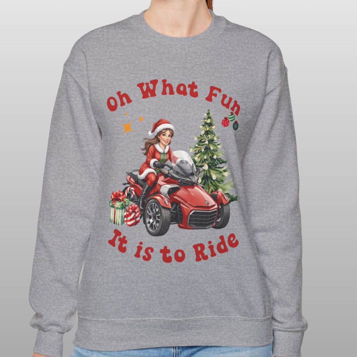 Person wearing a gray sweatshirt with a Christmas-themed design and text.